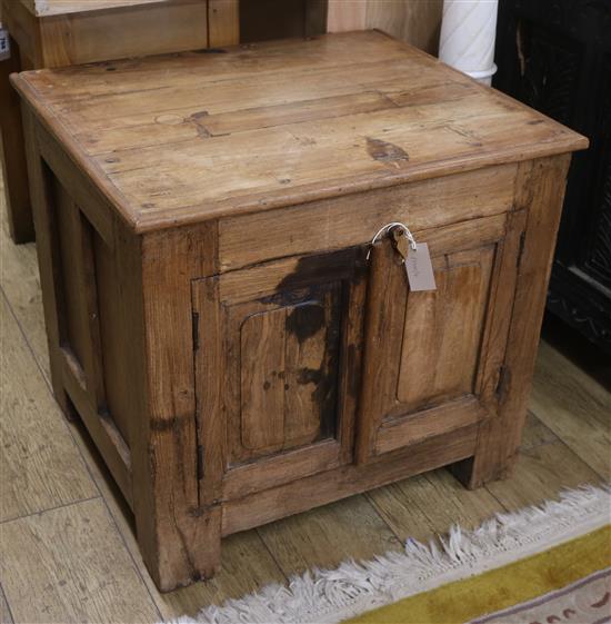 An oak two door cupboard W.66cm